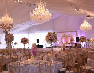The company’s large inventory became key for a wedding at the Kansas State Alumni Center: more than 15 semi loads of equipment for more than half a football field of tenting; 1,544 feet of sidewall, 430,000 watts of power, 8 commercial convention ovens, 7,075 pieces of silverware, 7,425 dishes, 11,633 glasses and more than 20 tent installers for 10 days. Photo: All Seasons Event Rental