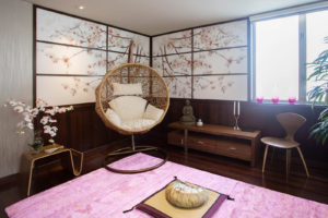 San Diego interior designer Michael Chambers achieved a Zen feel for a meditation room in a La Jolla home with mirror images of a cherry blossom tree digitally printed on canvas and then custom-framed to create the illusion of looking out windows. Photo: Jenny Siegwart