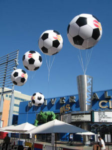 Helium-filled soccer balls by Air Dimension Design float outside a cinema at Universal City Walk in Los Angeles during the World Cup. Photo: Air Dimensional Design Inc.