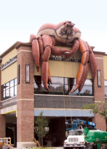 A crab draped over McCormick & Schmick’s in San Francisco, Calif., promotes the restaurant’s fresh seafood … vividly. Photo: Bigger Than Life.