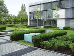 To reduce the heat-island effect (albedo) in urban areas, one method found especially effective in Europe is a hybrid green roof system that incorporates walkways over a carpark. This project, located in Weisbaden, germany, uses a system supplied by Zinco. Photo: Zinco.