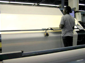 Employees use light to check for flaws in Mermet's solar protection fabrics at the company's South Carolina plant. Photo: 3G Mermet.