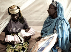 Women in a post-natal program at the Kaduna State Hospital in Nigeria receive Interceptor mosquito nets and instructions on how to use and handle them to prolong effectiveness over several years. Photo: BASF SE.