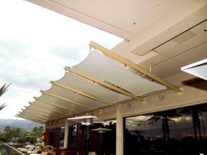 Tensile awnings grace the PGA West Stadium Clubhouse in La Quinta, Calif. Stainless steel catenary cables and fittings use pinned and bolted connections to ensure an economical and quick field installation. Photo: Eide Industries Inc.