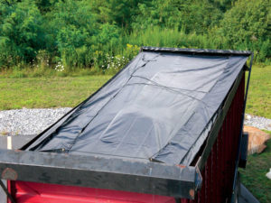 Automatic Load Cover LLC manufactured a hydraulic cover system with a 22-ounce vinyl tarp for a mulch truck. Photo: Automatic Load Cover