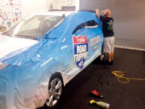 Latex ink offers improved flexibility, so the color holds as the wrap is stretched across the vehicle. Photo: Kauff’s Signs