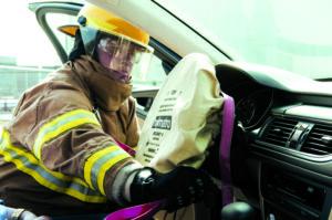 Airbags intended to protect driver and passenger in case of a crash are, in some recalled makes and models of car, potential sources of injury. The Secunet III airbag protection cover allows first responders to bag the steering wheel and keep moving. Photo: Holmatro Inc.