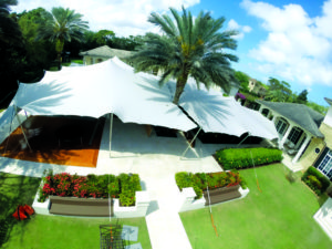 Nomad Tents joined two 60-by-40-foot stretch tents around a palm tree at a private residence in Jupiter, Fla., for an Els for Autism Pro-Am dinner. Photo: Nomad Tents