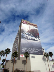 A multifaceted building wrap produced by Elite Media for BMW in Las Vegas uses a combination of pressure-sensitive vinyl, perforated window film and mesh. Pictured here is the south wall, covered in 3M PSV. Photo: Elite Media