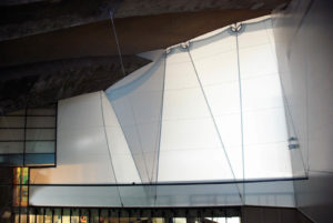 Sollertia Inc. installed two tensioned fabric walls of double curvature geometry inside Montreal’s Olympic Stadium to serve as effective barriers against the humidity between the indoor pool and a gymnasium. Photo: Sollertia Inc.