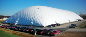 This air-supported fabric dome, located in Williamsport, Pa., provides indoor multi-sport use for soccer and golf. The structure is 246 feet by 550 feet by 78 feet high and is designed to withstand 90 mph wind loads and up to 35 pounds-per-square-foot snow loads using PVC-Tedlar-coated polyester fabric.  Photo: Big Span Structures
