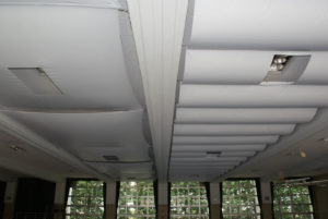 The gymnasium at Ichioka Commercial High School in Osaka, Japan, was part of a recent ceiling innovation experiment to test two types of membrane ceiling: tensioned (left) and suspension (right). The fabric used was G-1025BT white, flame-retardant PVC polyester from Teijin Frontier. Photo: Japan Tent Sheet Manufacturers Association