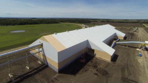 Source Energy Services’ sand storage facility in Alberta, Canada, constructed by Legacy Building Solutions Inc., can receive several unit trains monthly, each usually carrying more than 10,000 tons of material. Most transload distribution centers in the area provide about 2,000 tons. Photo: Legacy Building Solutions