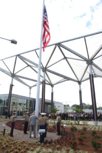 Awnings on the south-facing façade of the Vientiane-based U.S. Embassy mimic the structural motif of the larger freestanding canopies using folded ETFE panels.