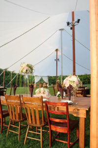 Sailcloth tents, like Anchor’s Aurora styles, lend themselves to a romantic and rustic aesthetic. Wedding décor may include “shabby chic” wood tables with mismatched chairs. Photos: Anchor Industries Inc.