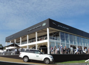 Automobile manufacturers create a luxury experience with temporary structures that look more like a flat-roof building than a tent. Land Rover/Jaguar was able to display cars inside and outside a Losberger Palas tent measuring 30 x 40 meters at the Goodwood Festival of Speed in Chichester, England. Photo: Losberger UK. 