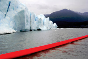 In his Red Line Project, aimed of bringing awareness to environmental catastrophes, Doron Gazit with Air Dimensional Design has installed a 500-foot-long inflatable tube in locations around the globe, including floating on the water at Alaska’s Knik Glacier in August 2016. Photo: Doron Gazit.