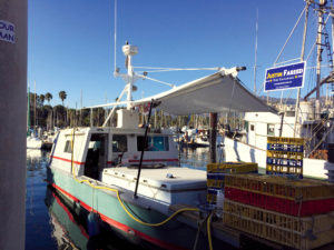 A cover made from Enviratex fabric has two functions: to protect workers on the crab boat from the sun, and to keep the water tanks a bit cooler in the summer months. Photo: Advanced Canvas & Upholstery Services.