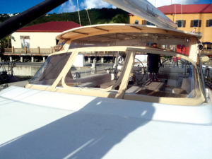 For this dodger, Marine Tech crafted a fixed awning–type top—attached using what the fabricator calls a “connector panel”—as well as side windows and aft screens. Photo: Marine Tech LLC.