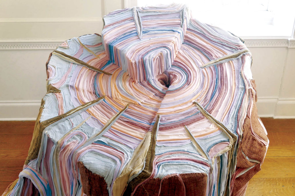 Tree stump sculptures made from fabric Specialty Fabrics Review
