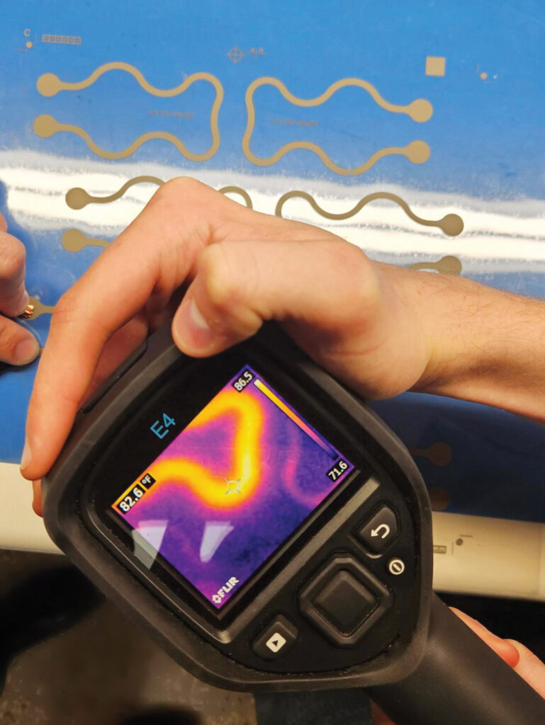 Multiple printed heaters on one sheet of thin urethane rubber. The thermal camera shows how power is being sent to only one element on the sheet.