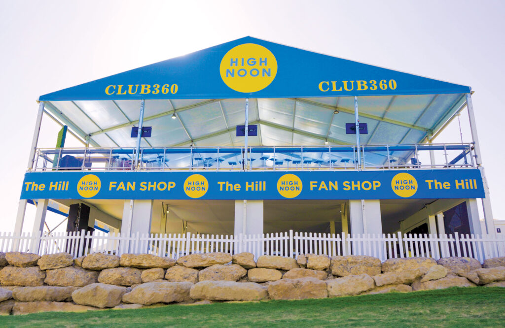 A large double-decker tent with High Noon on it, labeled Club360.