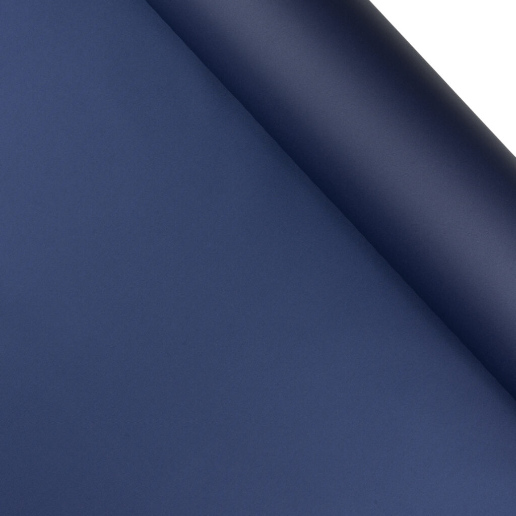 A navy roll of eTek™ 600D Solution-Dyed Polyester.