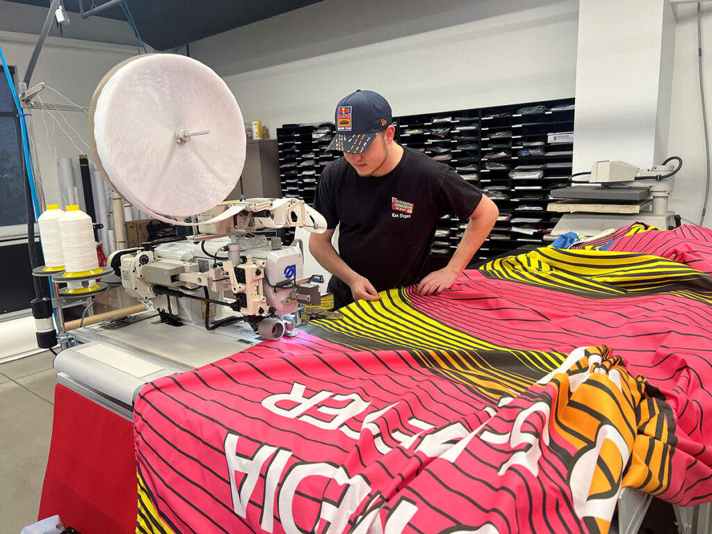 A fabricator working with DD7788 Perfect Knit in a shop. 