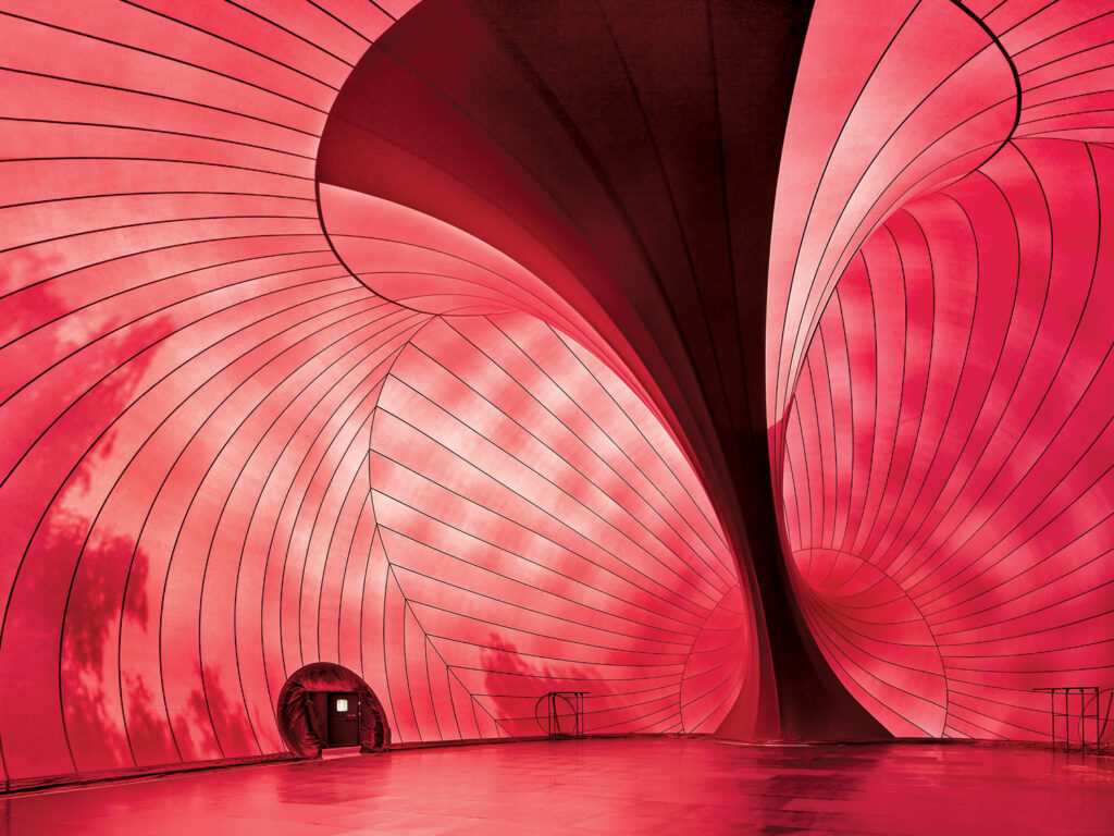 The inside of an inflatable amphitheater. It is red. 