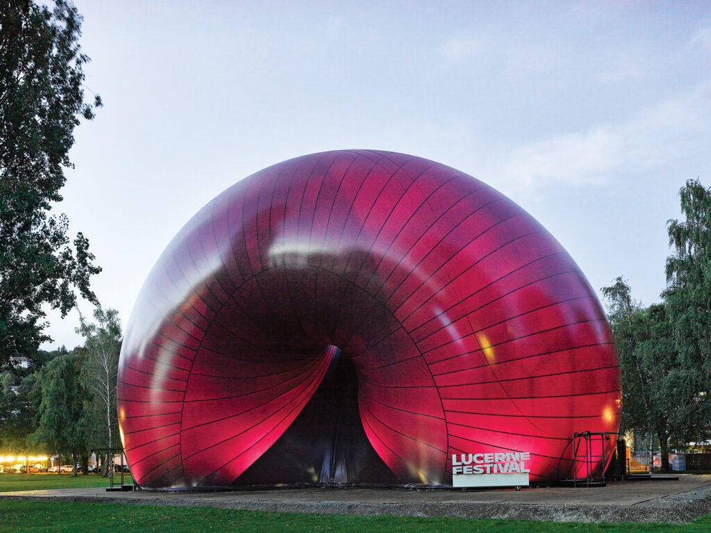 The outside of an inflatable venue, which is purple hued in color.