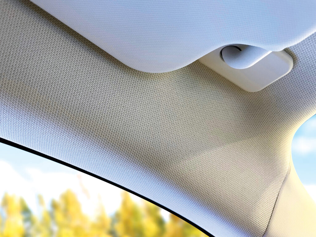 Shawmut Corporation’s Terra™ warp knit headliner fabric in a buff color.