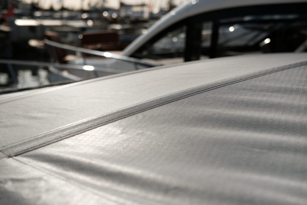 Close-up of a retractable roof made from Stamoid Light fabric, overlooking boats.
