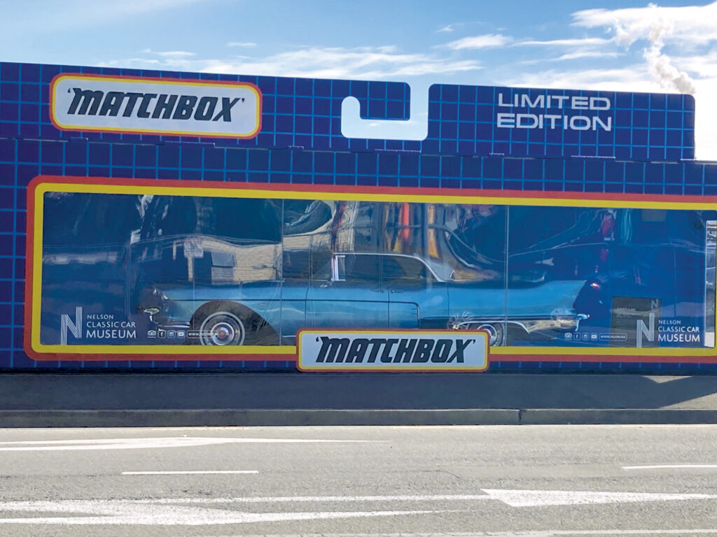 Detailed display of a vintage Cadillac Eldorado Brougham in a mock life-size Matchbock case, featuring a blue exterior.