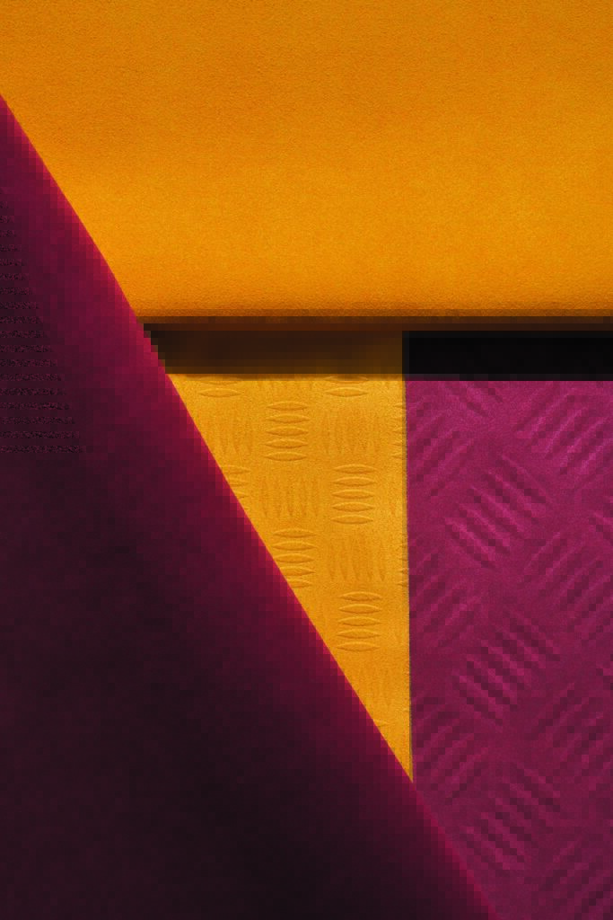 Vibrant fabric swatches in yellow, deep purple, and textured burgundy, arranged in a visually striking layered composition.