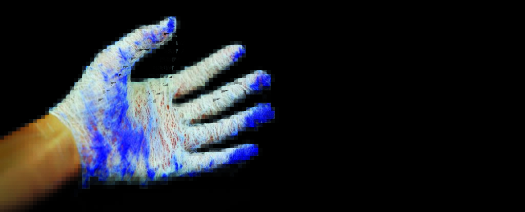 A white, textured hand covered in blue patterns, reaching out against a black background.