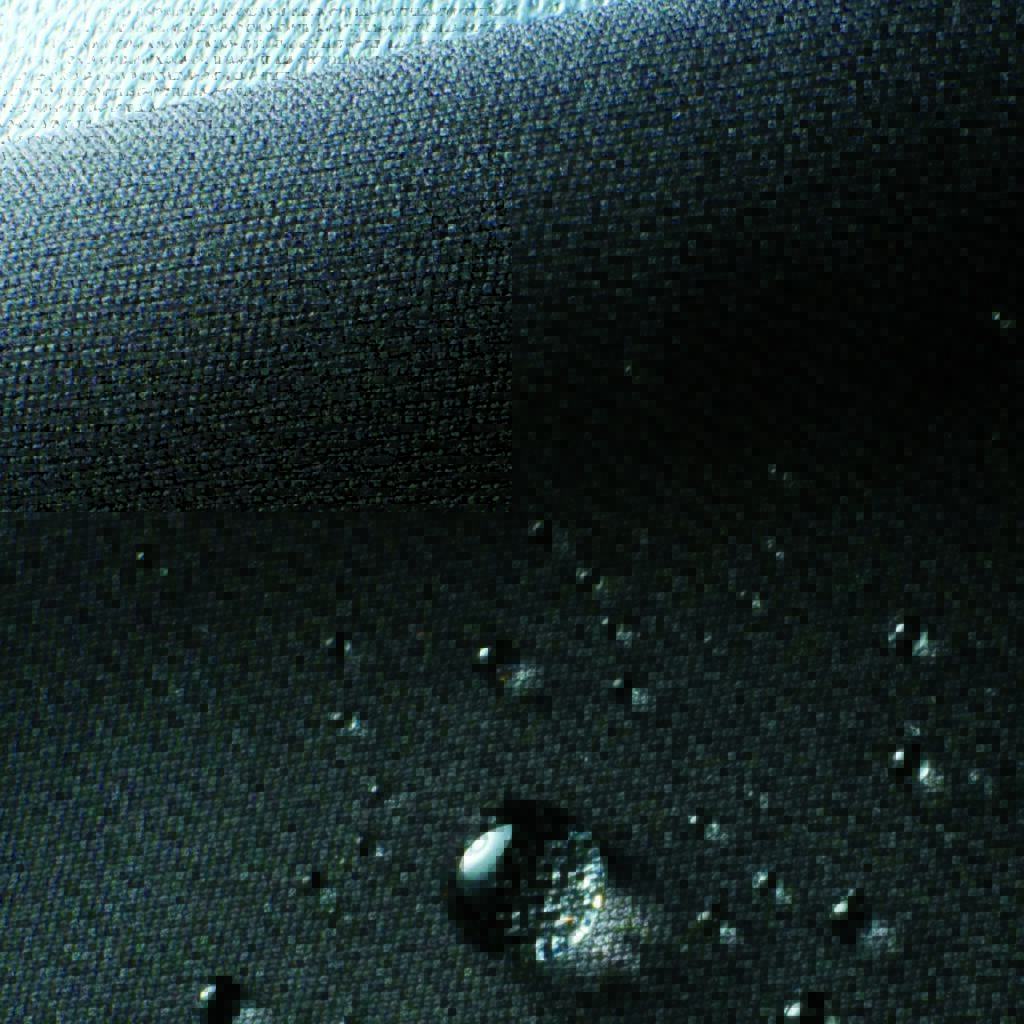 Close-up of textured dark Polartec AirCore fabric with water droplets on it, showcasing a water-repellent surface. Light reflects off the fabric’s weave.